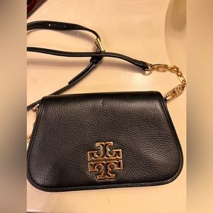 Tory Burch mini black crossbody purse with gold accents. Magnetic closure.